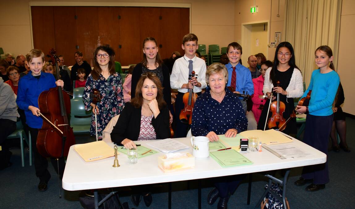Adjudicator Cheryl Oxley and scribe Louise Sneesby with the string performers. Photo: AMY McINTYRE