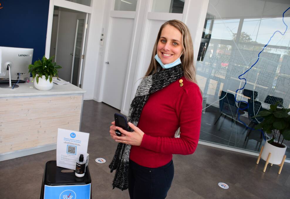 Decision made early: SJ Shooter Real Estate managing director Laura Shooter at the office, which chose to introduce check-in via QR code long before required by the NSW government. Photo: AMY MCINTYRE