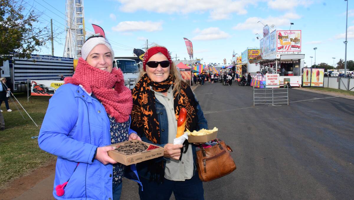 BRISK BUT DRY: Zoe and Deb Larkings are all smiles and warm at the 2021 Regional Australia Bank Dubbo Show on Friday. Photo: AMY MCINTYRE.