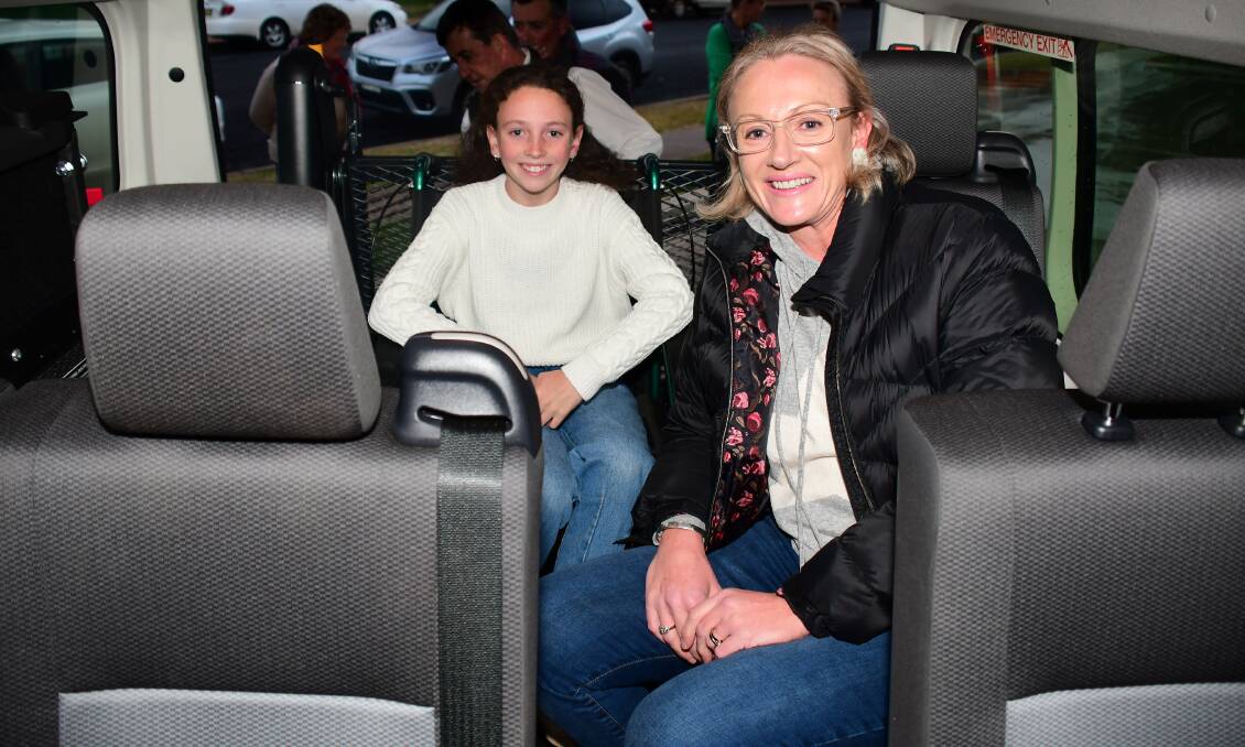FINALLY HERE: Lucy and Jane Diffey testing out the specialised van for Yawarra Community School. Photo: AMY McINTYRE