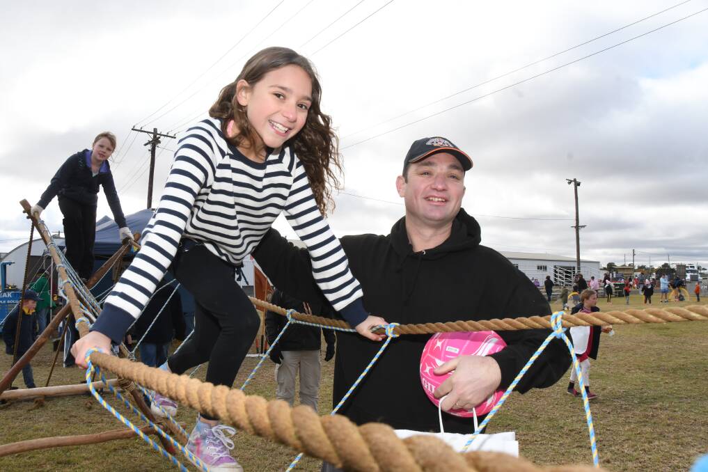 QUALITY TIME: Annastacia and her dad Justin Adams spending time together at the festival on Sunday. Photo: AMY McINTYRE