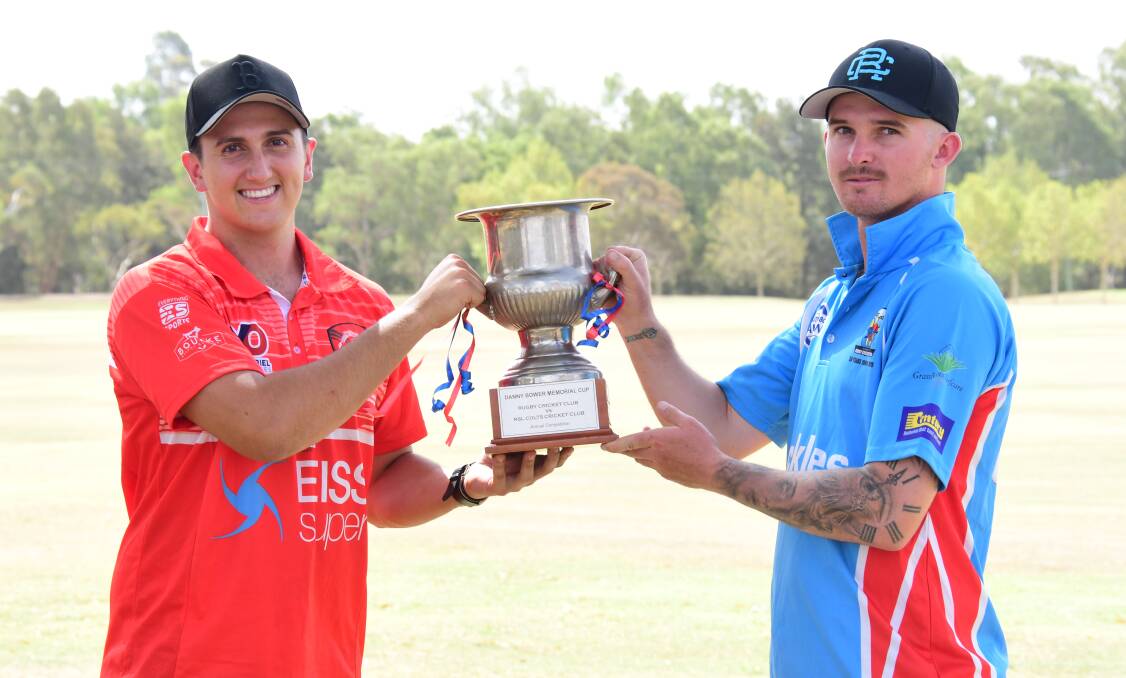 READY TO GO: RSL-Colts captain Marty Jeffrey (left) with Rugby counterpart Jacob Hill and the Danny Bower Cup. Photo: AMY McINTYRE