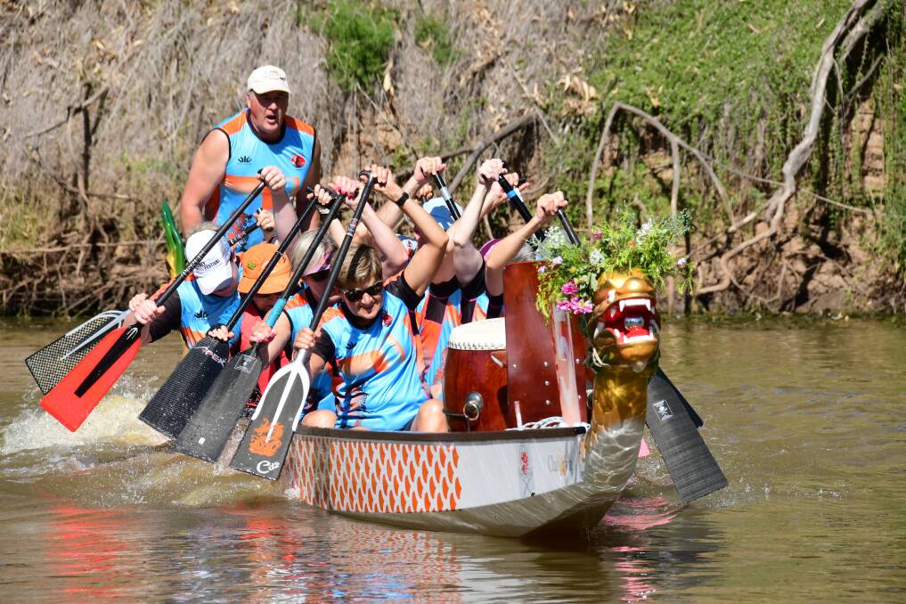 AWOKE: Dubbo's Outback Dragons Boat Club officiates new boats through awakening ceremony. Photo: AMY McINTYRE.