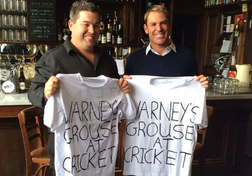 Legendary meeting: Michael Earl (left) with Shane Warne in 2014, during a visit to Melbourne 13 years after his infamous 'dummy spit' in the crowd at the WACA in Perth. Picture: Supplied
