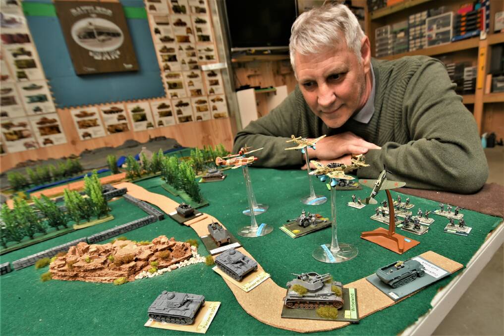 WAR GAMES: David Stanley with his World War II tabletop battle scenario. Picture: CHRIS SEABROOK
