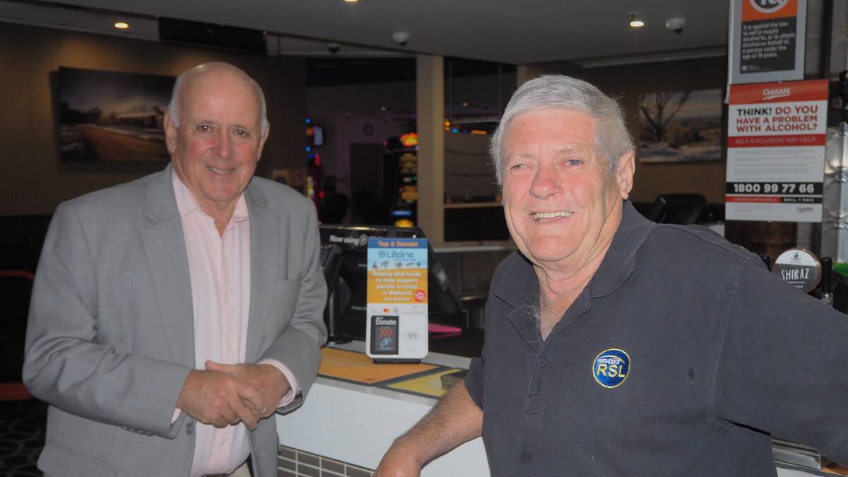 FUTURISTIC FUNDRAISING: Lifeline Central West executive director Alex Ferguson with Bathurst RSL Club president Ian Miller at the launch of the Tap and Donate program on Tuesday. Photo: SAM BOLT