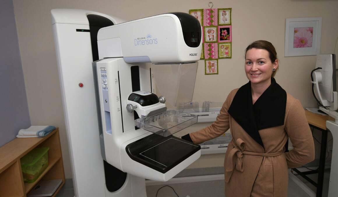 TAKE A FRIEND: BreastScreen NSW health promotions officer Kay Smith with a breast screening unit. Photo: CHRIS SEABROOK