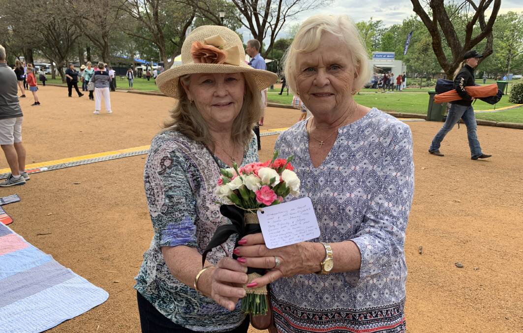 Sisters Elizabeth Atkin (from Canberra) and Sharon Askew (from South West Rocks) in Victoria Park. Photo: NADINE MORTON 101718nmroyal12