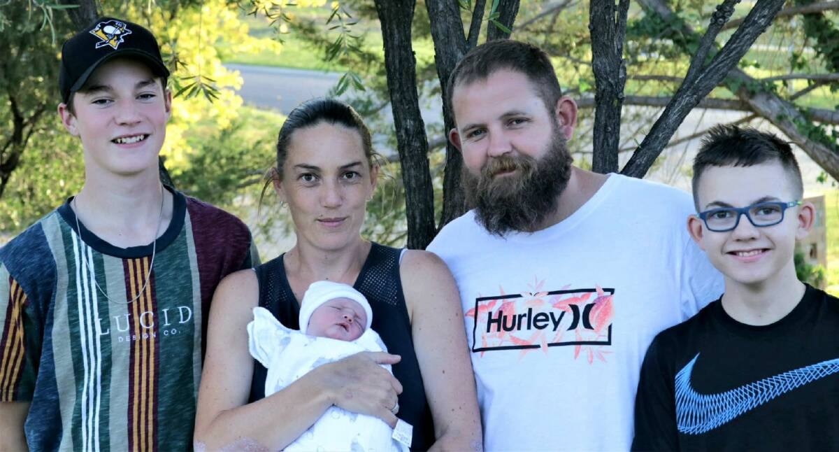 LITTLE ONE: Erica and Mat Traves with their newborn son Mace, who arrived on April 10. Also pictured are the couple's older sons Cooper, 15, and Kalan, 11. Photo: TABATHA DAYMOND