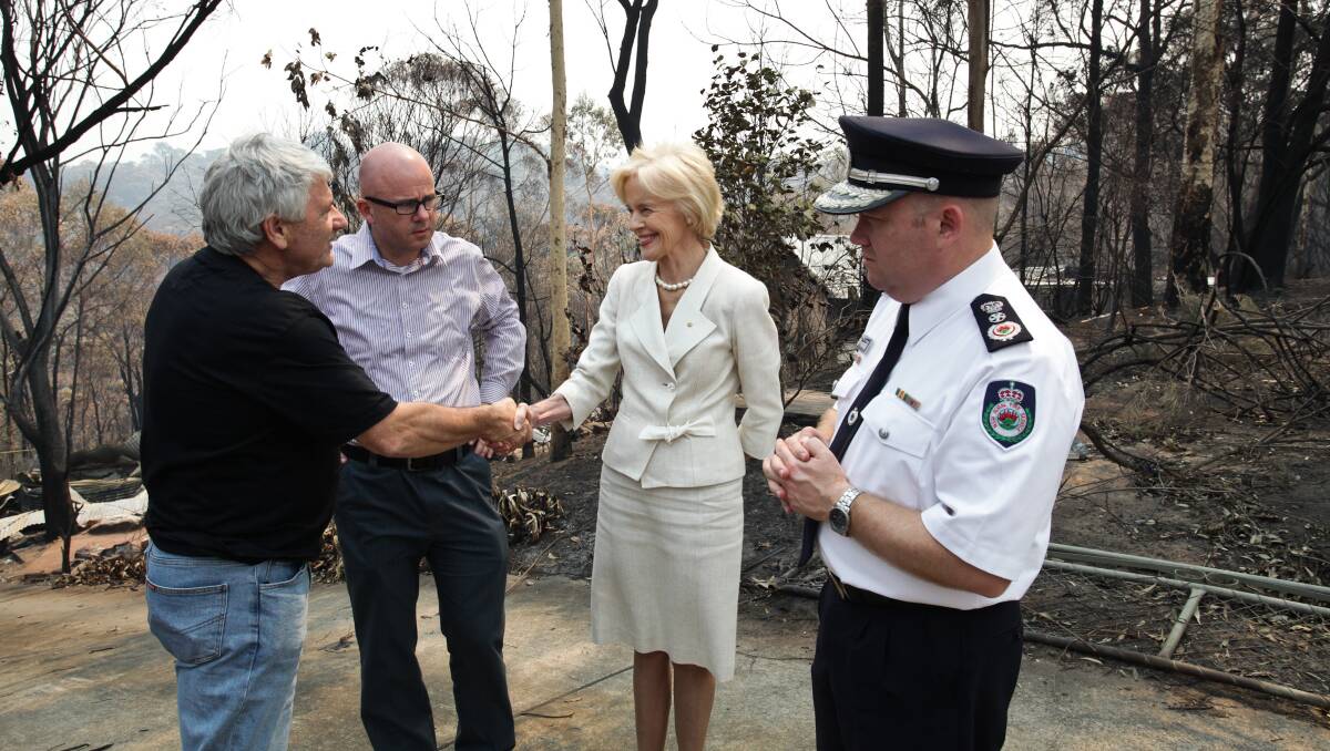 IN CHARGE: The then NSW RFS Commissioner Shane Fitzsimmons, pictured with then Governor General Quentin Bryce, following the 2013 Blue Mountains bushfires. Photo: Geoff Jones