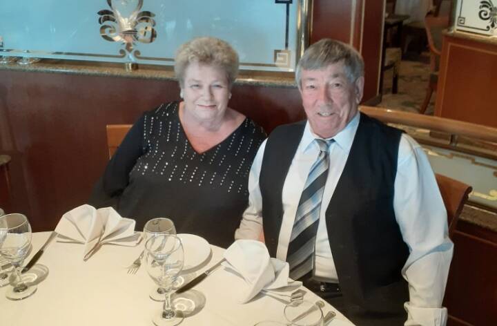 HAPPIER DAYS: Sue Smith and her partner Jayson O'Brien during happier times on the Ruby Princess. They both contracted COVID-19 on board. Photo: SUPPLIED