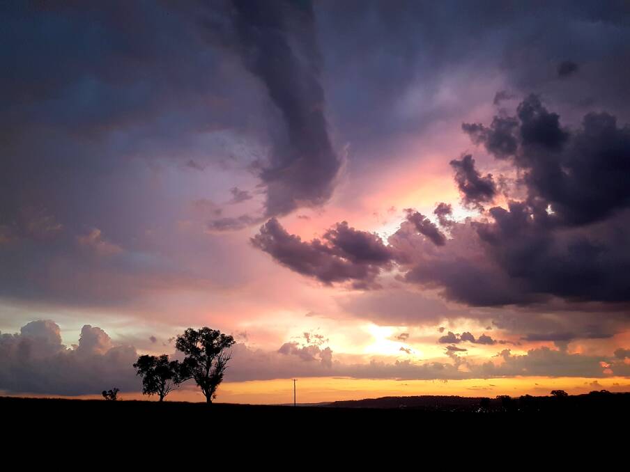 Sunset through the storm clouds tonight [on Sunday] looking towards Mount Panorama. Photo: TODD MCMAHON