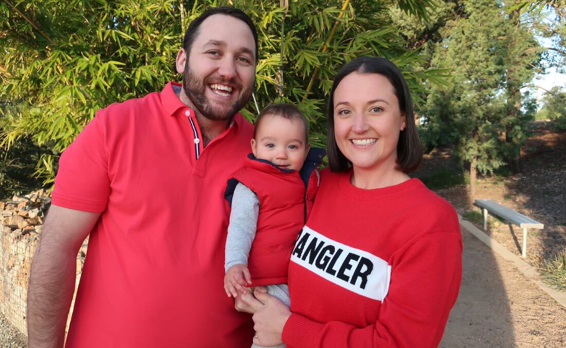 WEAR RED: Pat and Natalie Williams, with 10-month-old son Harvey, say Ronald McDonald House Orange allowed them to have vital bonding time when their son was born. Photo: SUPPLIED