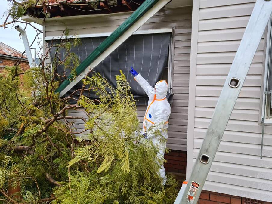STORM: A fallen tree brought down powerlines before it crashed onto a home in Parkes on Friday afternoon. Photo: PARKES FRNSW