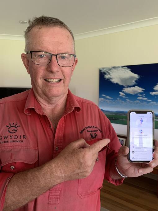 ON HIS PHONE: Parkes MP Mark Coulton is among those to have downloaded the app and he's urged others to do it too. Photo: SUPPLIED