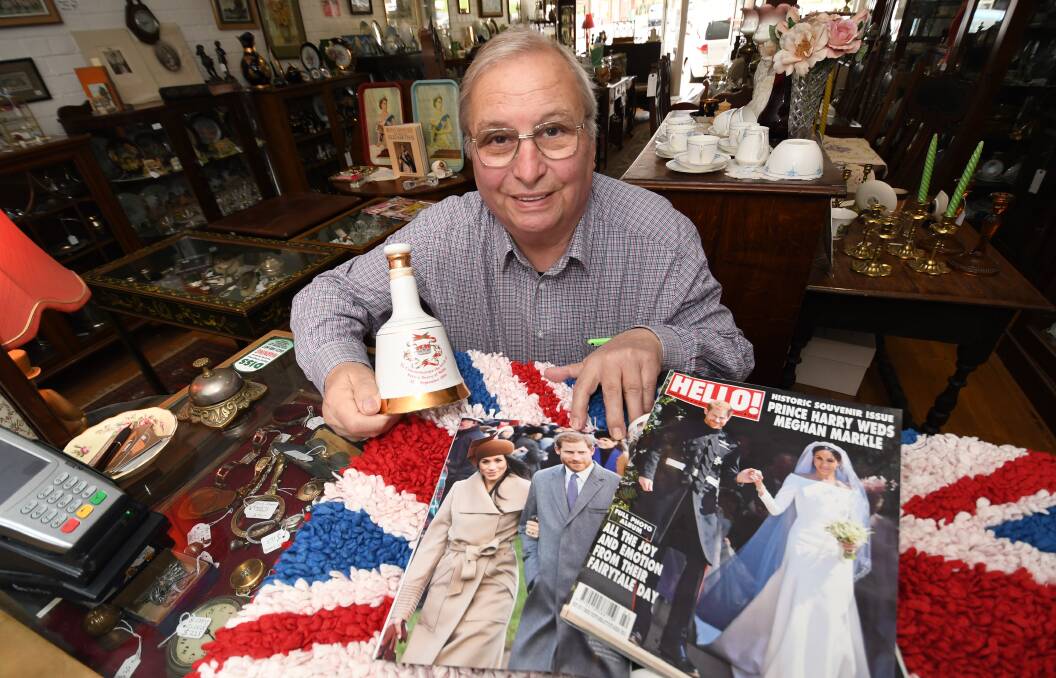 BOOM FOR BUSINESS: British born Martin King, with some of his royal memorabilia, says the upcoming visit by Prince Harry and Meghan Markle to Dubbo will be a boost for the city’s economy. Photo: CHRIS SEABROOK 092418cdubbo1