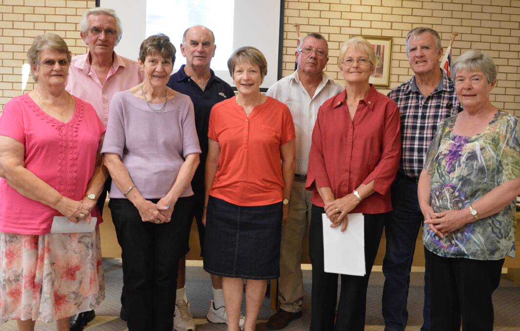 The firefighters of 1983 and their wives - Adrienne Bradley (representing Gordon Northey and Rodney Bradley), Roger and Jenny Larsen, Graham and Fran Dixon, Don and Jenny Jewell, and Robert and Kerrie Tinker at a Parkes Shire Council meeting in 2018 to share their story.