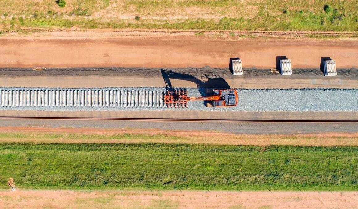PARKES TO NARROMINE: Sleepers are put in place along the Parkes to Narromine section of the Inland Rail, which is now officially complete. Photo: ARTC