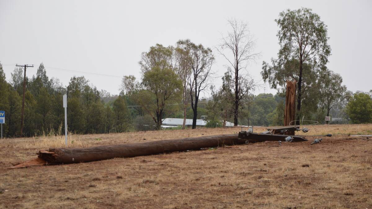BLACKOUT: A power pole and powerlines had come down in Molong Road during the January 6 wind storm in Parkes.
