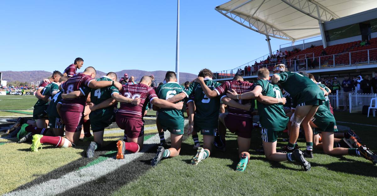 TOGETHER: Western players and their Manly counterparts following Sunday's match.