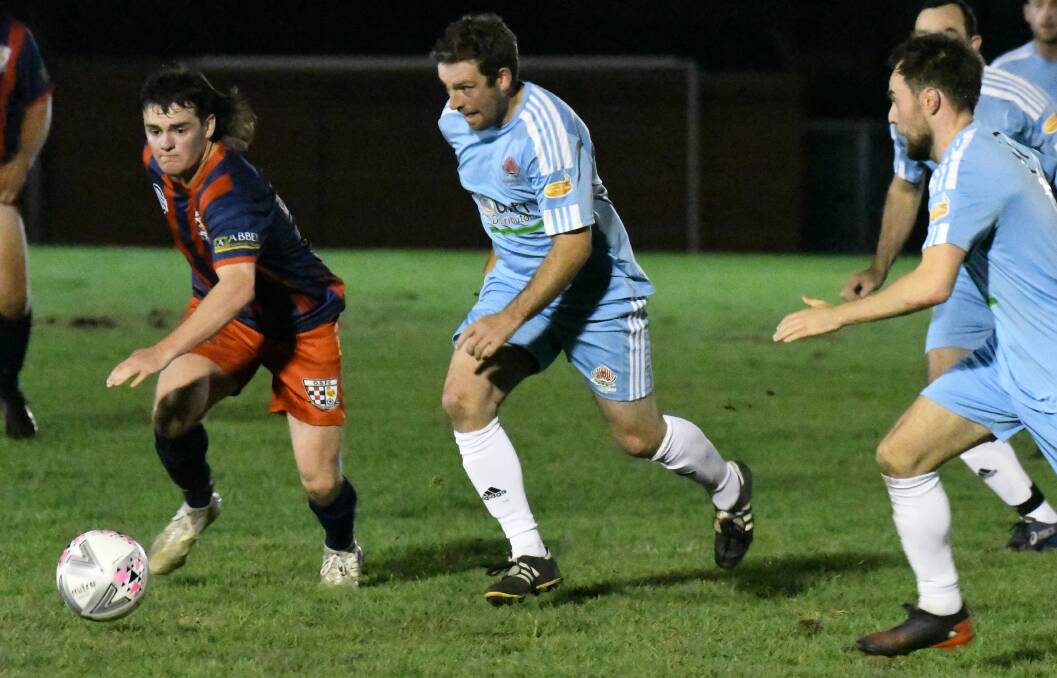 IN-FORM: Waratahs forward Craig Sugden in action during his side's 3-1 victory over Orana Spurs on Saturday night. Photo: JUDE KEOGH