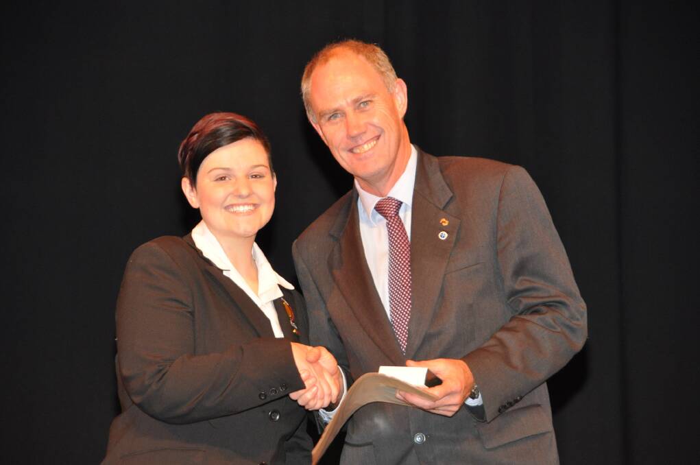 Senior Campus captain Heidi Carolan receives her leadership award from principal Richard Skinner.