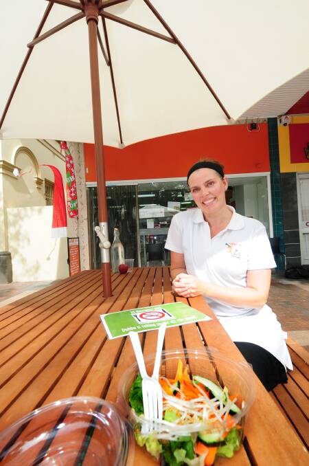 Owner of salad run in Dubbo, Sharon Campbell, enjoys sitting in the business's smoke-free alfresco dining area.					  Photo: LOUISE DONGES