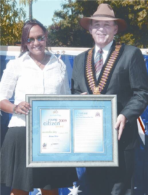 Brinae West receving Young Citizen of the Year award from mayor Greg Matthews.