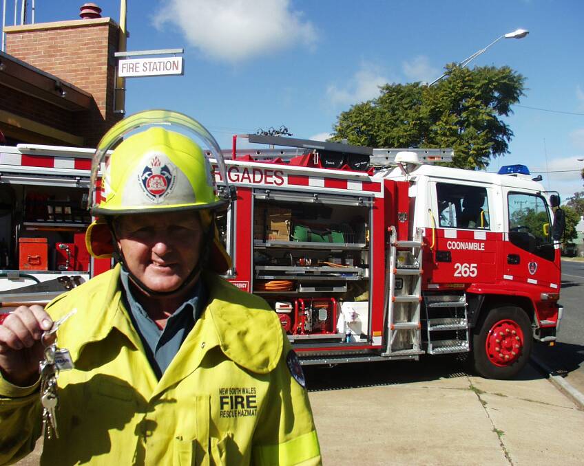 Kent Morley with the key to a new fire truck for Coonamble in 2003.