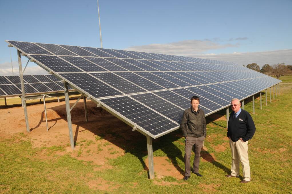 Nathan Henkes and Dick Smith with the new solar power system at Macquarie Club Dubbo. Photo: AMY MCINTYRE