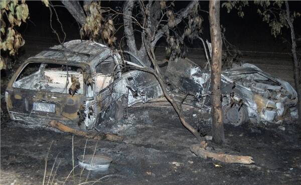 The bodies of two people were discovered in the burned-out wreckage on the Parkes to Wellington road but a 19-year-old passenger managed to free himself and seek help at a nearby property.
