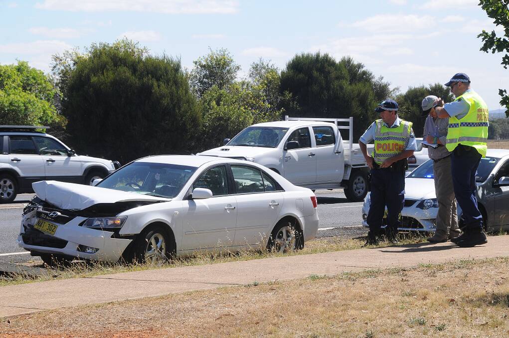 A woman was taken to hospital after a Hyundai sedan crashed into a four-wheel drive at Dubbo yesterday afternoon. 	Photo: AMY MCINTYRE