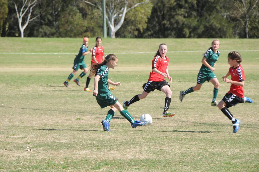 Western’s Jessie Medlyn from Orange attacks the ball on the opening day of the New South Wales Girls Soccer Championships being played at Dubbo's Lady Cutler complex. In this game Western finished with a 0-0 draw against Metro West. 	Photo: BELINDA SOOLE
