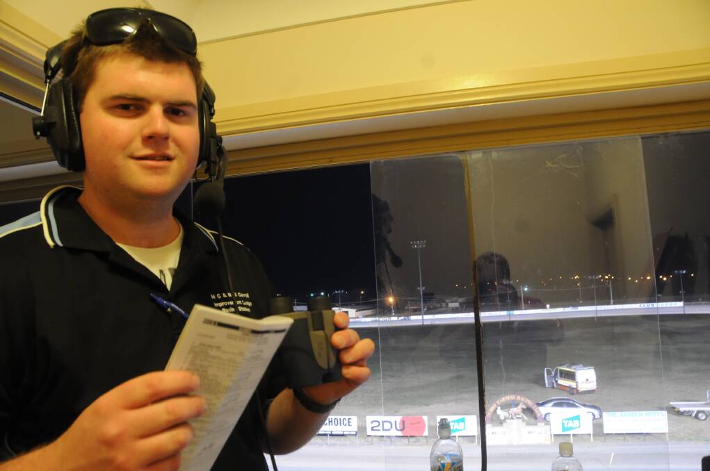 Michael Dumesny in the caller s box at the Dubbo Paceway.  
Photo: BEN WALKER