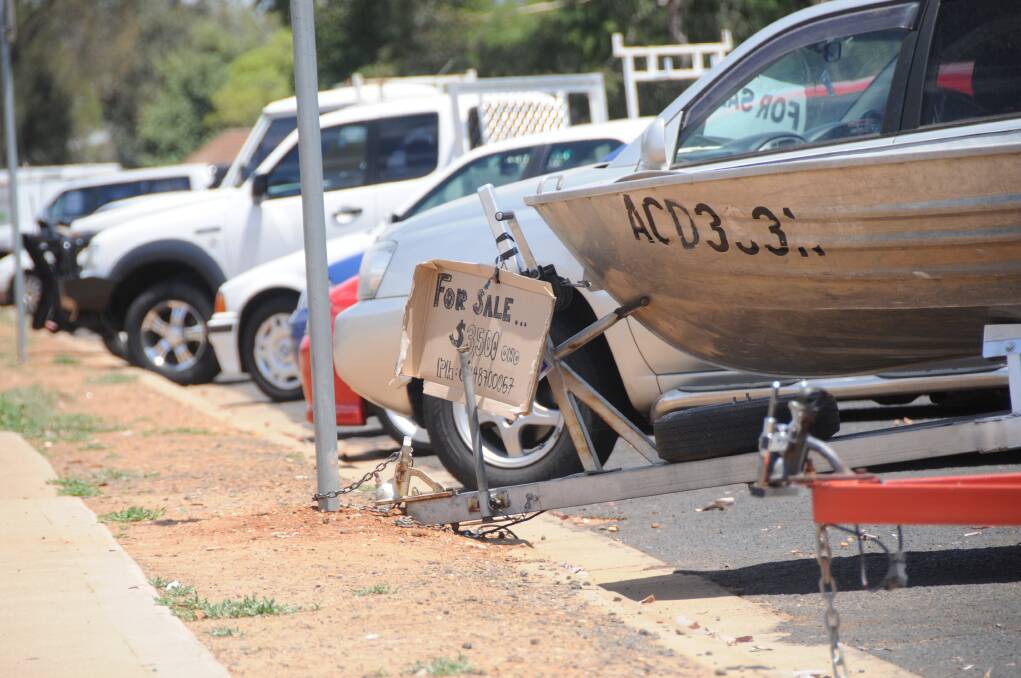 Tinnies, cars and more displayed for sale at Apex Oval, but not for much longer. Dubbo City Council will start enforcing a prohibition of vehicle being offered for sale in the area.	Photo: JOSH HEARD