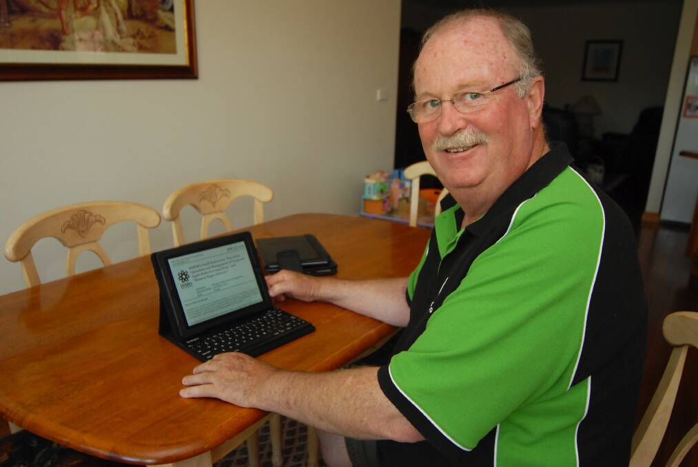 Dubbo s longest-serving councillor, Allan Smith, with his new iPad issued by Dubbo City Council.	Photo: BELINDA SOOLE