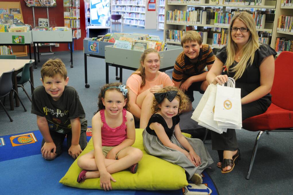 Eoin, Amoya and Orlagh Quigley with Rosetta and Robert Betts, and Sarah Warner were enjoying the Summer Reading Club at Macquarie Regional Library. 	Photo: AMY McINTYRE