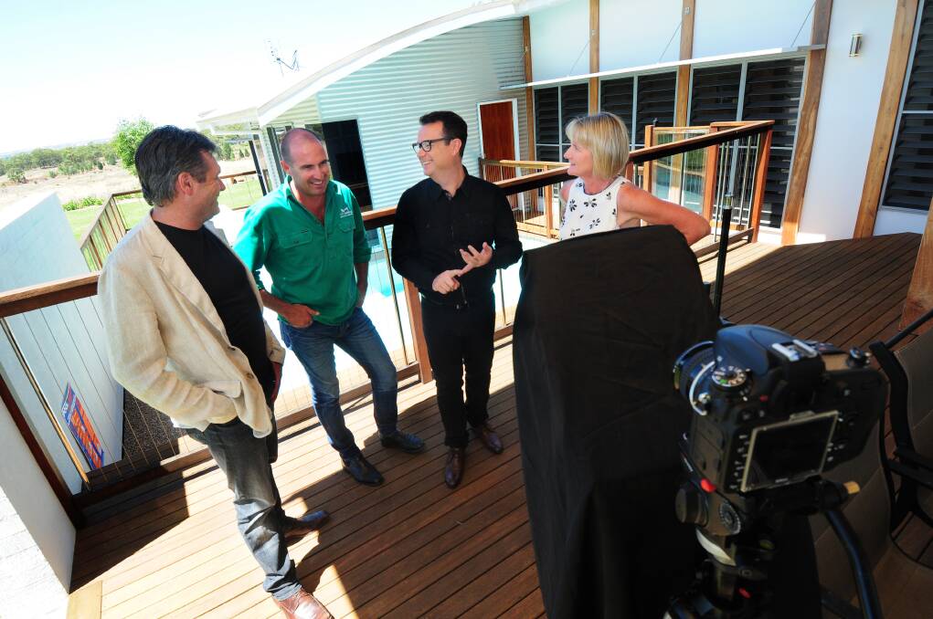 Gary Takle (second from right) interviews building designer Gavin Dale, builder Stephen Orth and owner Debbie Pritchard.  
Photo: LOUISE DONGES