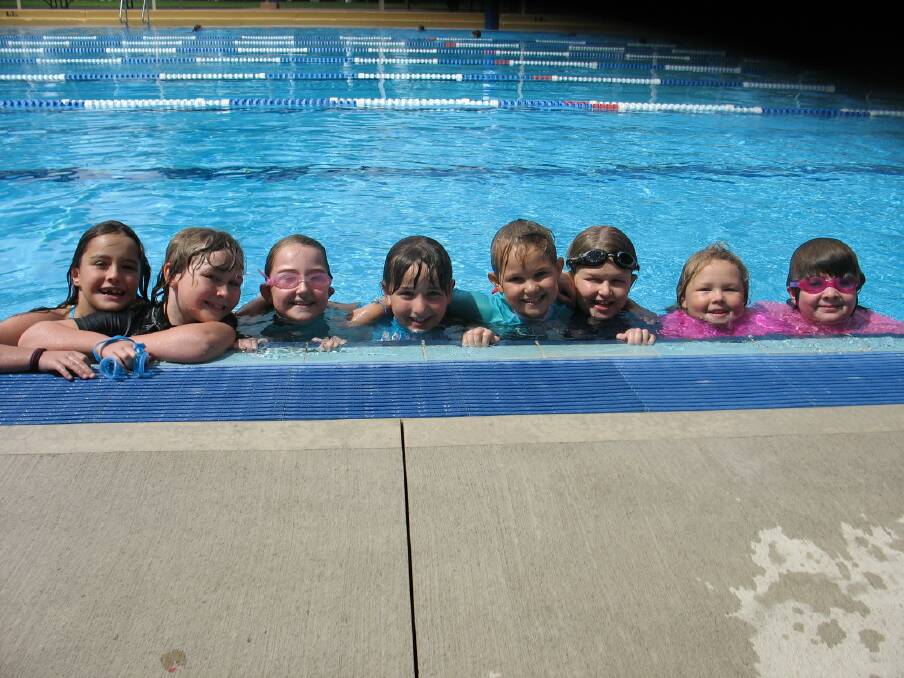 A group of girls enjoying the pool.