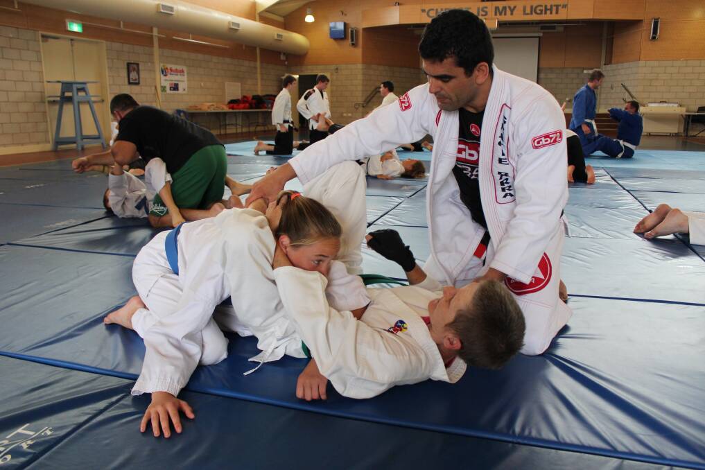 Indianna Asimus and Cathy Keevers under the watchful eye of Professor Marcelo Frizante from Gracie Barra in Sydney