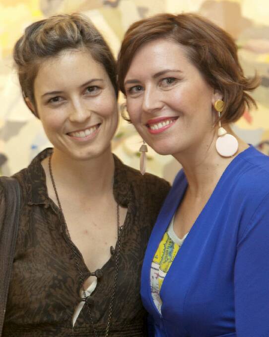 Room with a view: Missy Higgins (left) and Kate Tucker at Tucker's "Viewfinder" exhibition opening at Helen Gory Gallerie.