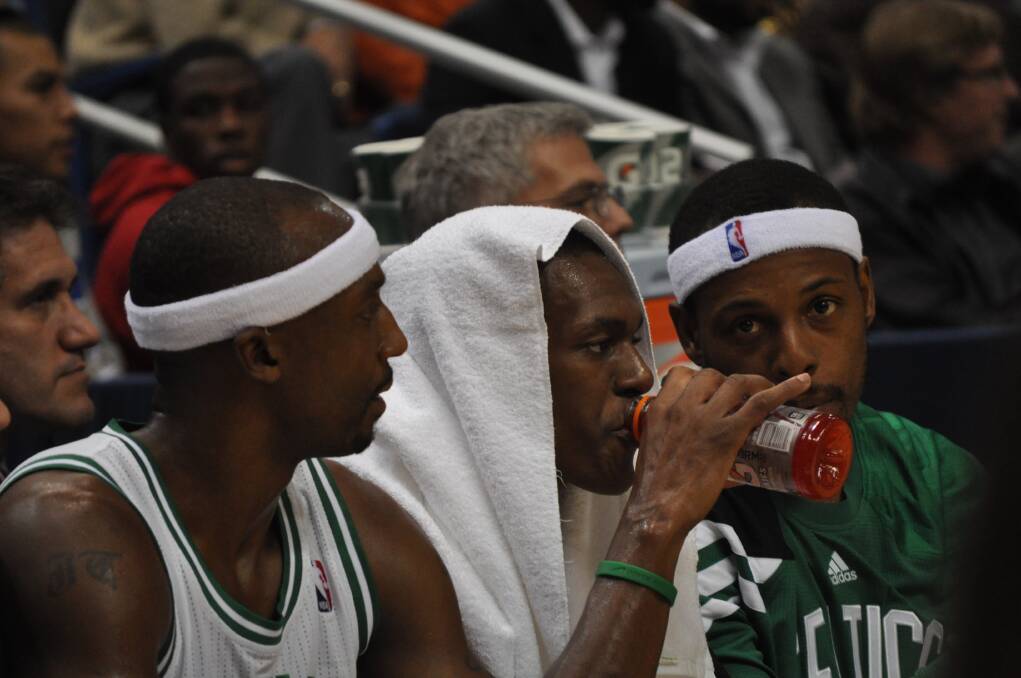 Boston Celtics players Jason Terry, Rajon Rondo and Paul Pierce enjoy some time on the bench.