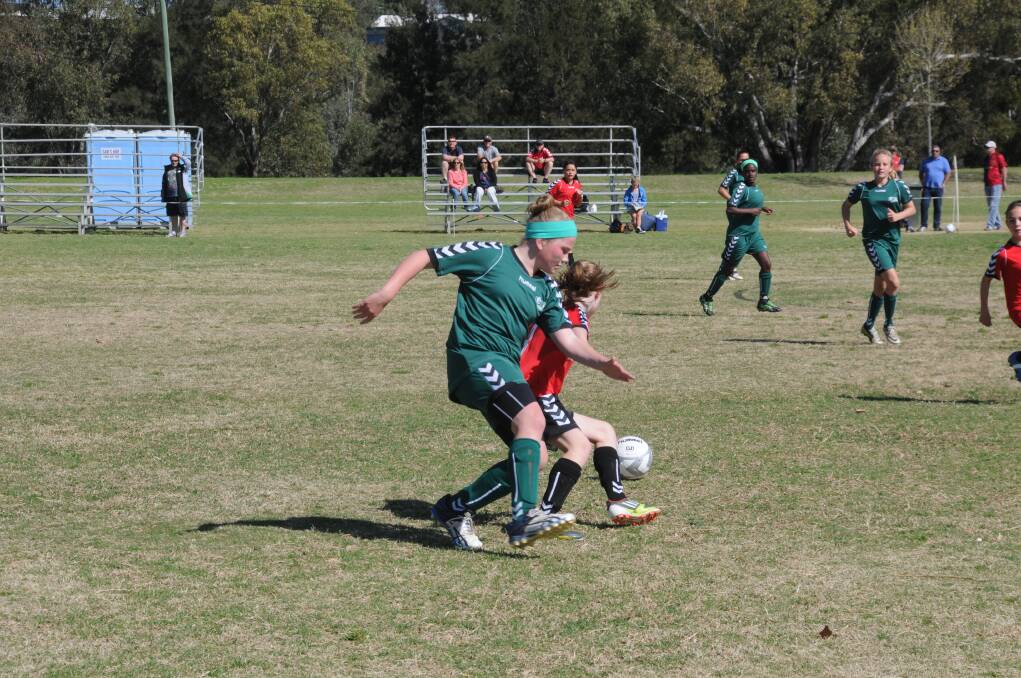 Gabby Farraway from Bathurst is beaten for the ball as Western under-12s finished 0-0 against Metro West. Photo: BELINDA SOOLE