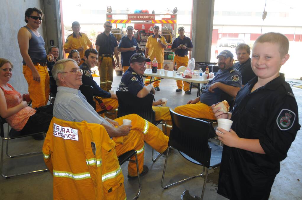 Junior cadet Adam Lummis with Dubbo Headquaters volunteers on standy at Fire Control headquaters having a barbecue while preparing for impending flair ups, Sunday.PHOTO: LISA MINNER
