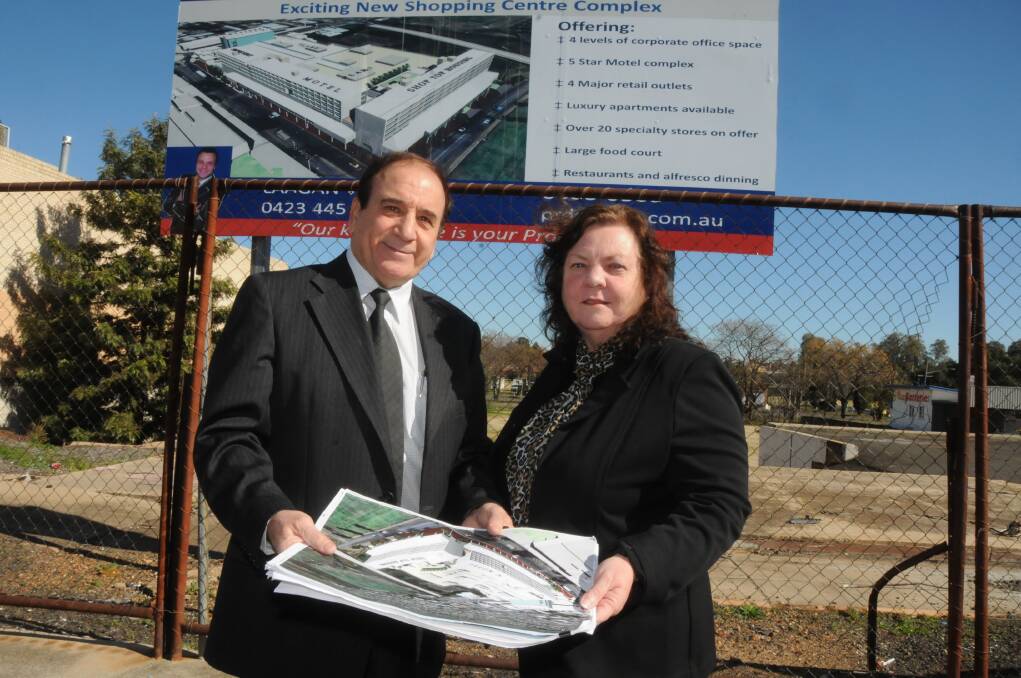 John and Trish Kosseris in Macquarie Street after their plans for the $53.8 million Riviera Shopping Centre were approved. It had the greatest value of any of the 557 applications approved in 2012. (File photo).