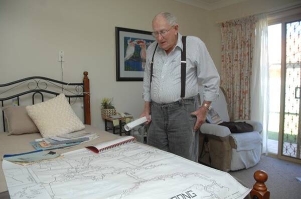 Bill Inwood, with the help of others who remember Burrendong, has mapped who lived where in the town before the dam was built and flooded.                Photo: AMY GRIFFITHS