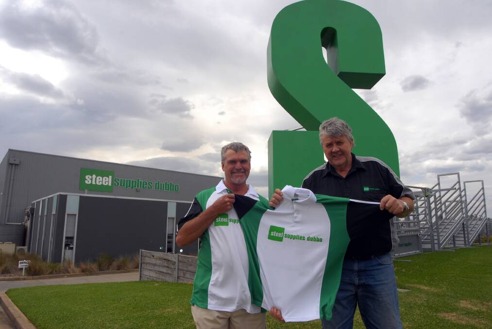 Captain-coach Lester Hoy receives team shirts from Steel Supplies part-owner Phill Goatcher.  
Photo: BELINDA SOOLE