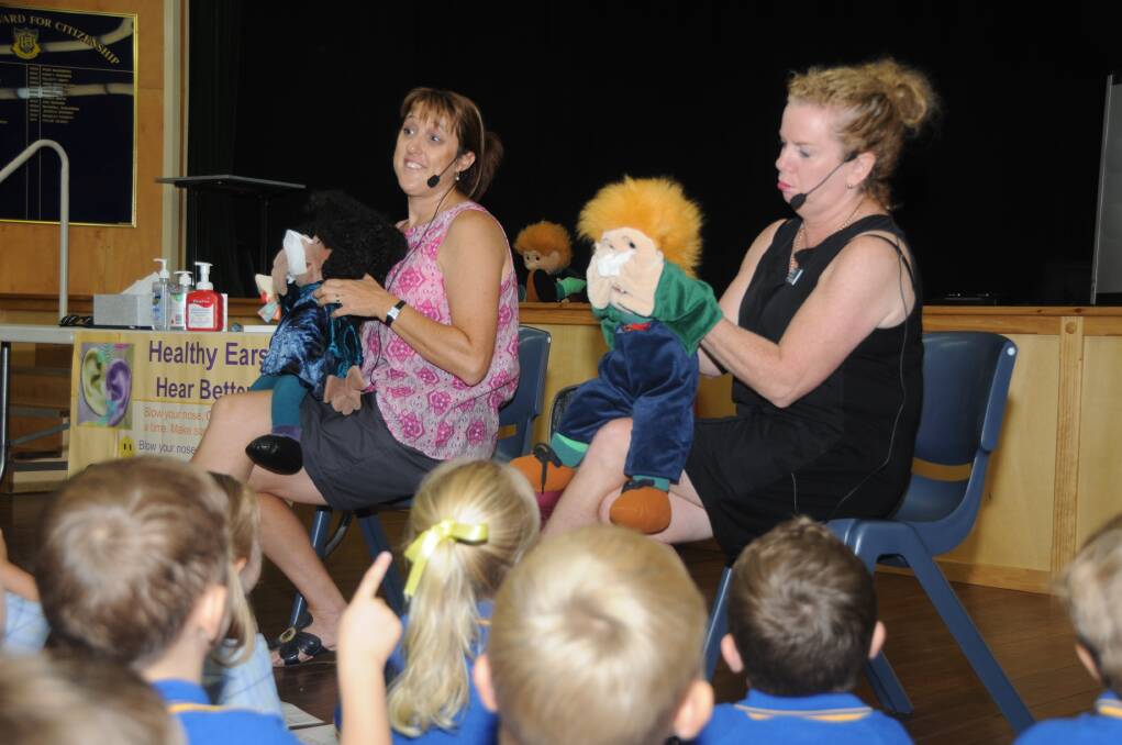 Department of Education hearing support teachers Rachel Mills and Donna Rees deliver the Healthy Ears lesson, with the help of puppets 'Lucy' and 'Sam'. (Photo: AMY MCINTYRE).