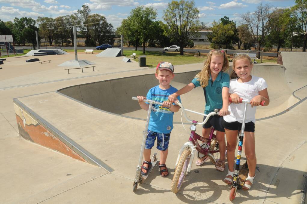 As Kaiden Stoddard celebrated his fourth birthday with Jasmine Stoddard and Ciara Beeston at Dubbo's skate park this week, councillors debated if they had responsibility for providing sun protection at the facility.  
Photo: AMY MCINTYRE