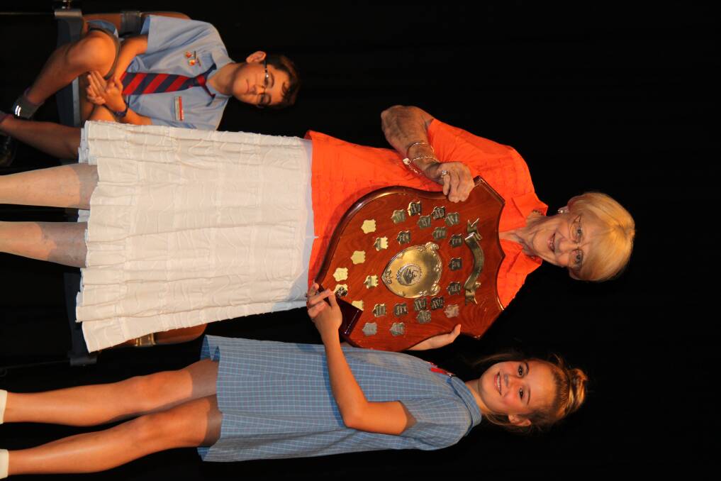 Mrs Hoynes presents the LH ford Memorial Shield to Courtney Power.